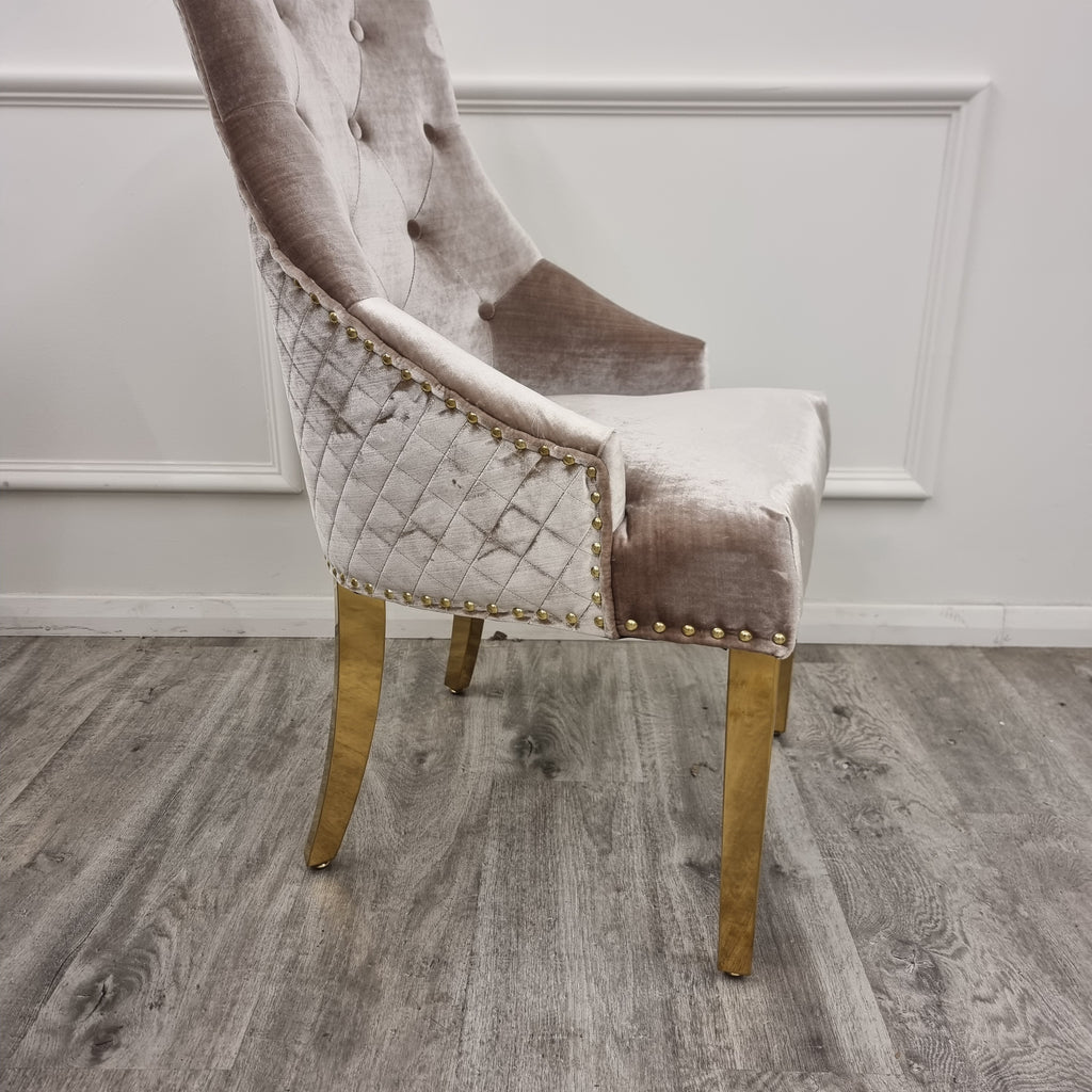 Decorative chair with gold accents against a textured wall.