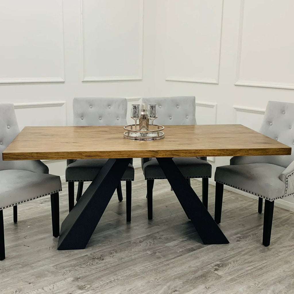 Dining table with four grey tufted chairs 