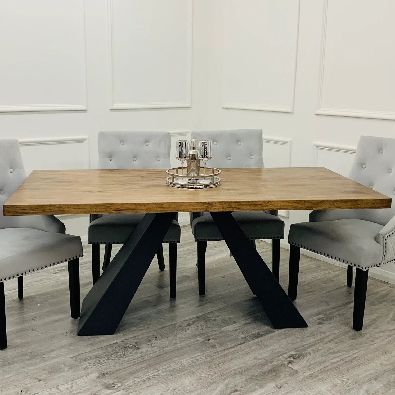 Dining table with four grey tufted chairs 