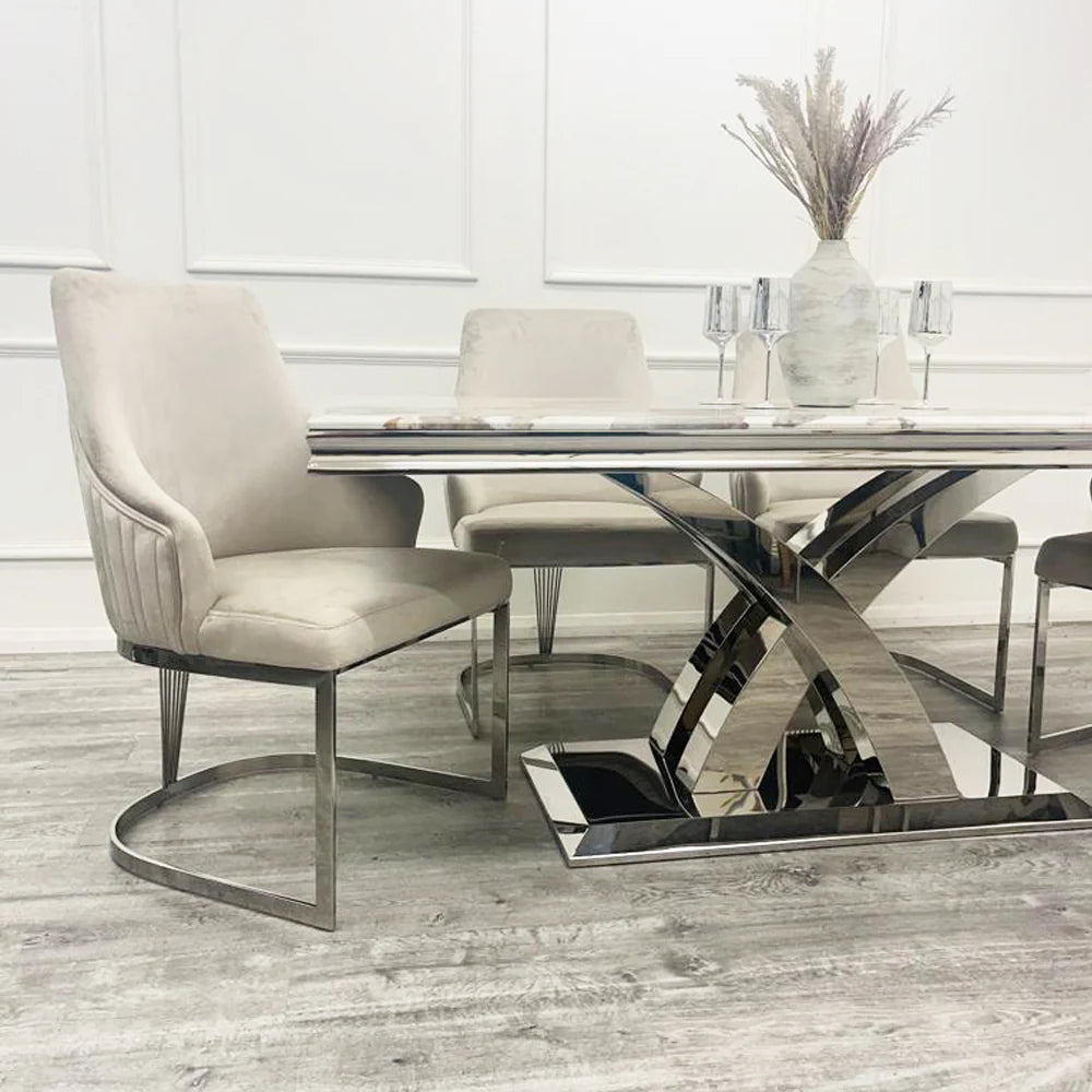 Modern dining table with silver and beige chairs 