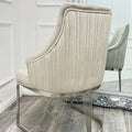 Beige upholstered chair with silver frame