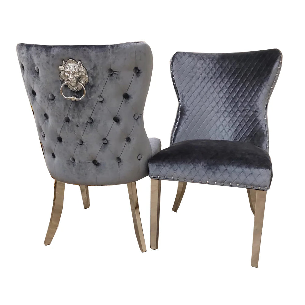 grey upholstered chairs with decorative silver lion knocker and legs