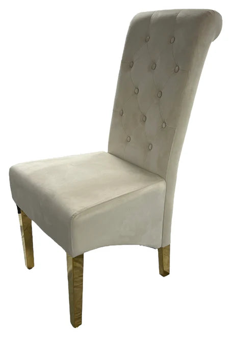 Cream upholstered chair with buttoned backrest and gold legs