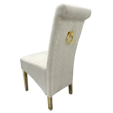 white velvet upholstered chair with gold ring and legs