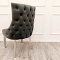 Dark grey tufted chair with chrome legs at first class interiors with nationwide delivery