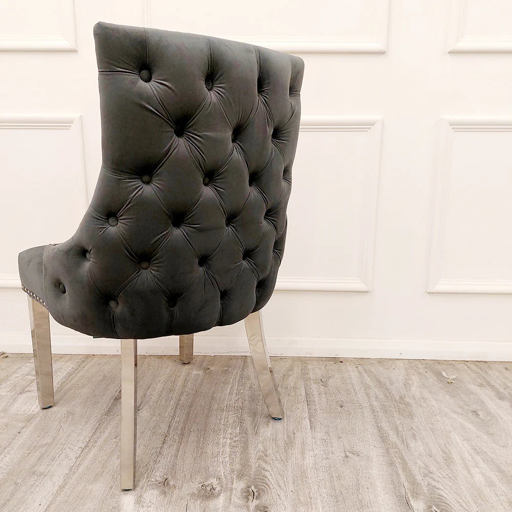 Dark grey tufted chair with chrome legs at first class interiors with nationwide delivery