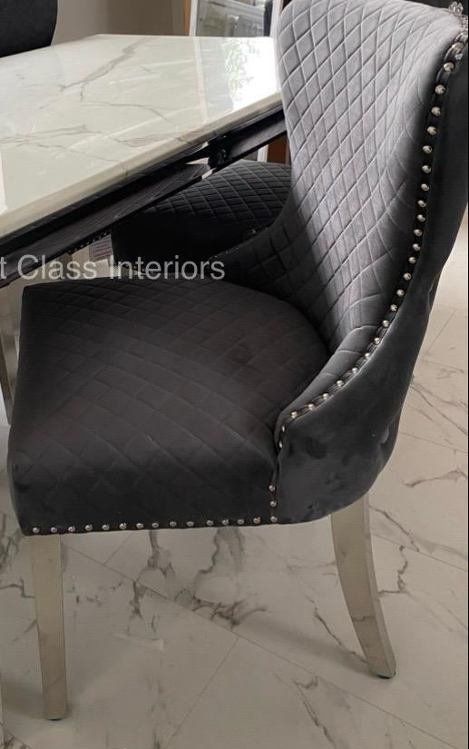 Grey quilted chair with studded details and silver legs first class interiors
