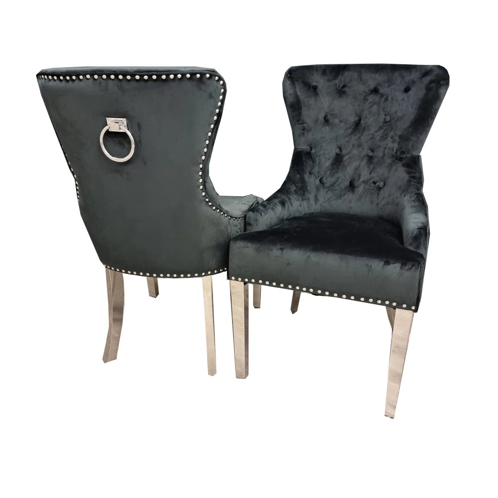Two black upholstered chairs with silver decorative ring