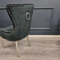 Black velvet chair with silver trim and ring knocker