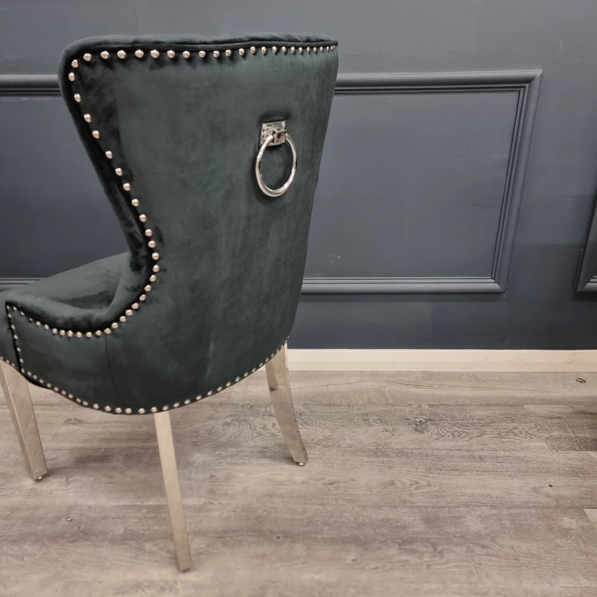 Black velvet chair with silver trim and ring knocker